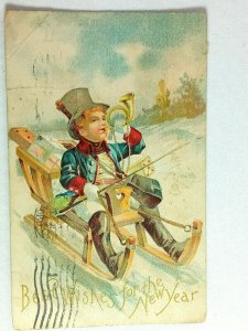Vintage Postcard 1908 Best Wishes for the New Year Boy with Horn a Sled