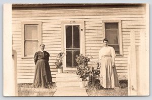 RPPC Postcard Two Women In Front Of House In Dresses c1900s - 1910s  P1