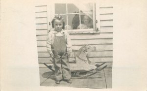 Postcard RPPC C-1910 girl rocking horse toy overalls 23-10577