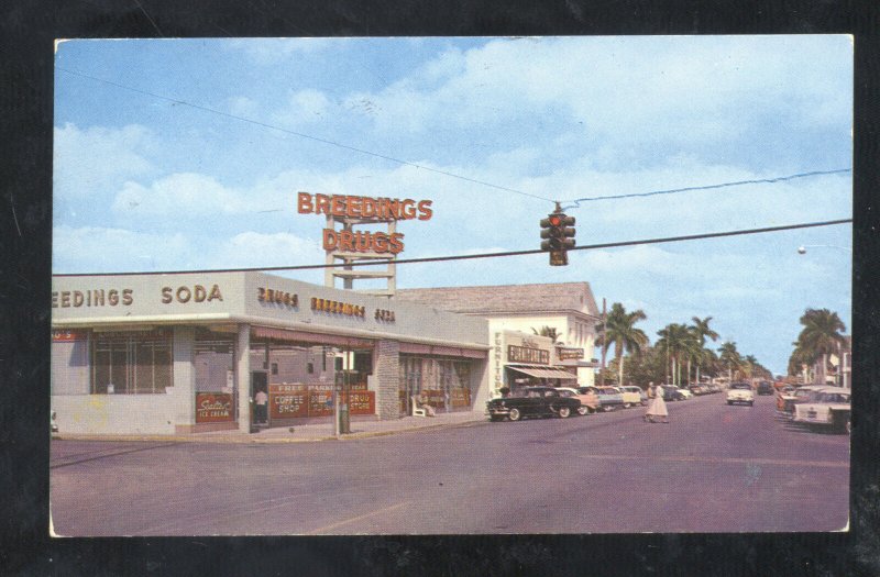 HOMESTEAD FLORIDA DOWNTOWN STREET SCENE DURG STORE OLD CARS VINTAGE POSTCARD