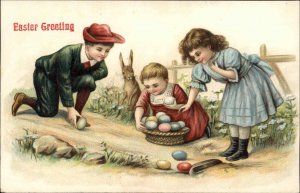 Easter Children Play with Eggs Bunny Rabbit Watches c1900s-10s Postcard