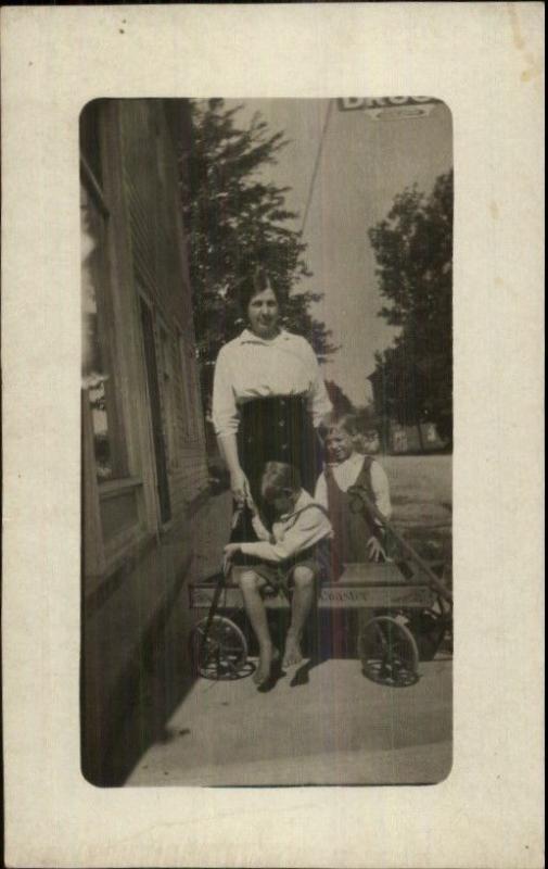 Children in Wagon w/ Mother on Street c1910 Real Photo Postcard