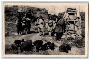 c1920's Tibetans Pigs Farmers Burlington Darjeeling Studio Tibet RPPC Postcard 