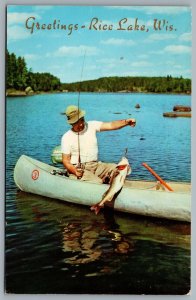 Postcard Rice Lake WI c1963 Greetings From Rice Lake Man Fishing In Canoe