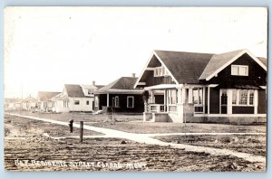 Conrad Montana MT Postcard RPPC Photo Residence Street Houses Dirt Road 1917