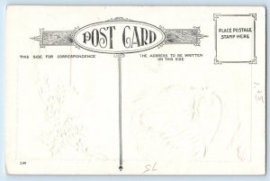 c1910's Christmas Santa Claus Holly Berries Winter Scene Embossed Postcard