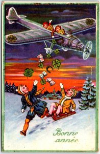 Kids Throwing Cards and Clovers from Aeroplane - Bonne Annèc - Vintage Postcard