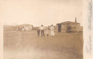 Lisbon North Dakota Family with Cottage Real Photo Vintage Postcard AA69117