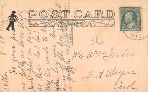 Marion Wisconsin Main Street Higgins and McQueen Druggists Postcard JI658181