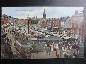 Norfolk MARKET PLACE at GREAT YARMOUTH shows Busy Market & Open Top Trams c1920