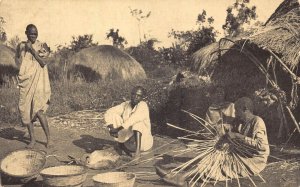 Uganda Natives at Basket Work Huts Ethnic vintage postcard
