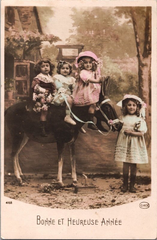 Happy New Year Victorian Kids On A Donkey Vintage RPPC 09.54