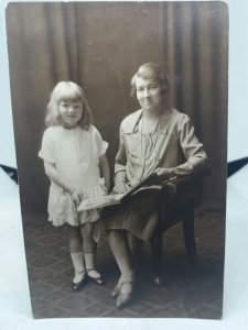 Mother With her Young Daughter Reading a Book Brighton UK Vintage Postcard 1930s