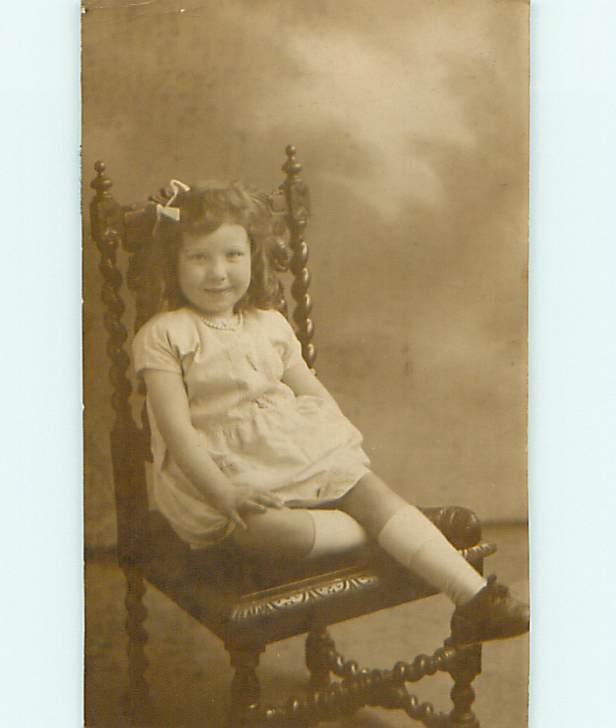c1910 rppc MINI POSTCARD - CUTE CURLY HAIRED GIRL ON ANTIQUE SPIRAL CHAIR r6730