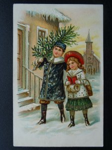Christmas Greetings BOY & GIRL WITH CHRISTMAS TREE c1906 Embossed Postcard 