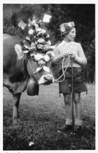 A126 Real Photo Cow Flowers & Flags on Head Boy Flower Hat postcard