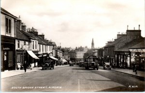 RPPC  AIRDRIE, Scotland   STREET SCENE  c1930s  Cars   Postcard