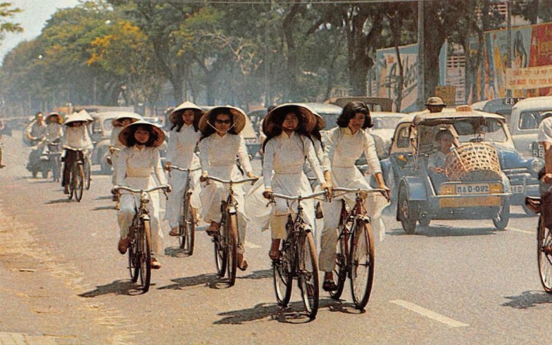 High School Girls Cycling Ao Dai Bicycles Vietnam c1960s Vintage Postcard