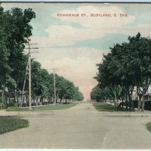 c1908 Scotland, S. Dak. Residence Street Litho Photo Postcard Hand Colored A29