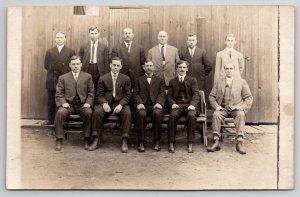 RPPC Group of Handsome Men Photo Alongside Fence Postcard V22