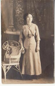 RPPC   LADY by WICKER CHAIR  postcard