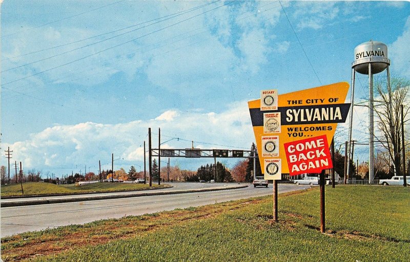 F87/ Sylvania Ohio Postcard Chrome Water Tower Welcome Sign