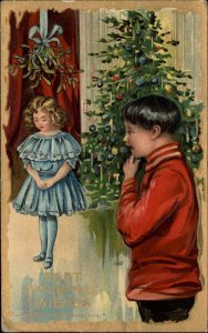 Christmas Boy Sees Little Girl Under Mistletoe c1910 Vintage Postcard