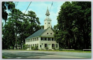 Postcard Midway Church Building along Street Bet Savannah & Brunswick Midway GA