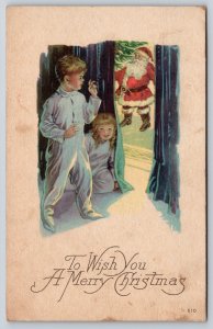 Karle #510~Christmas~Children Peek Thru Curtain~See Santa~c1920 Vintage Postcard