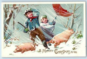Christmas Postcard Children Boys And Pigs Blowing Wind Umbrella Embossed Tuck