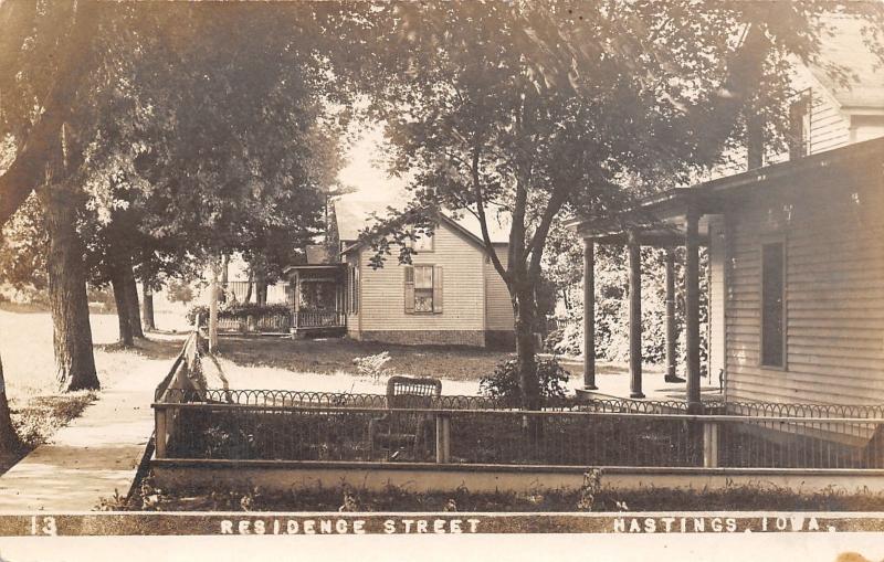 Hastings IA Rocking Chair & Metal Fence Around Home~Neighbor RPPC c1910 Postcard 