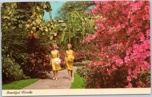 Women in Yellow Dresses strolling through the Azaleas, St. Petersburg, Florida