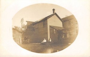 House With A Woman Sitting in the Yard Real Photo Unused 