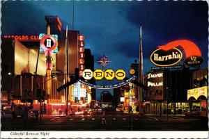 Reno at Night Neon Signs Nevada Postcard Silver Dollar Harold's Harrah's