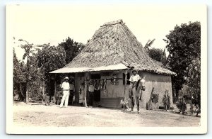 1920s PANAMA  THACH ROOF HUT  MERCHANT HIDES DRYING  RPPC POSTCARD P1649