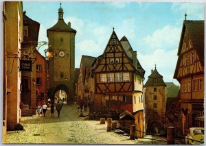 VINTAGE POSTCARD CONTINENTAL SIZE WALKING THE STREETS OF ROTHENBURG GERMANY