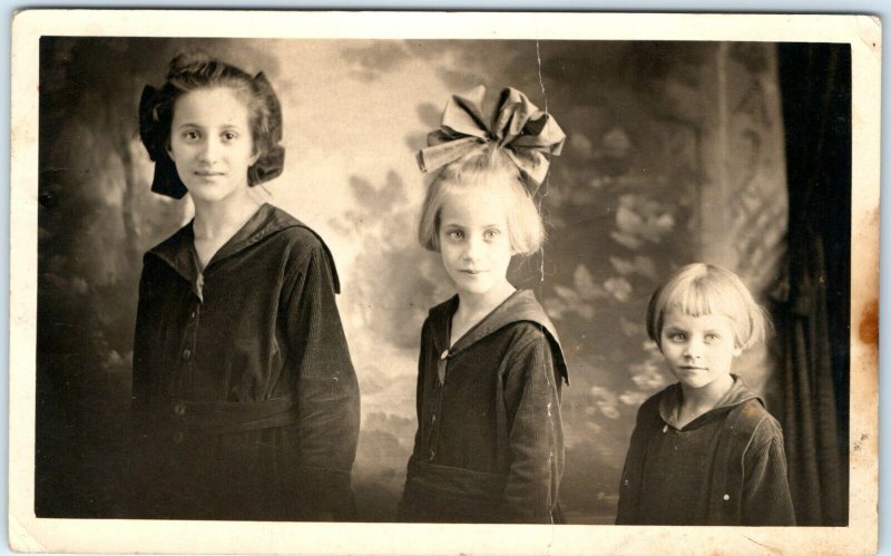 c1910s 3 Cute Little Girls RPPC Sisters Real Photo Postcard Children Artura A45