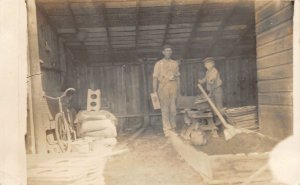 F99/ Forest City Iowa RPPC Postcard 1911 Garage Father Son Bicycle