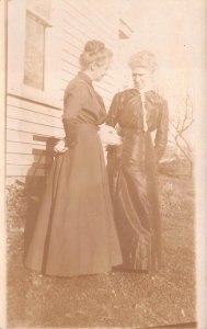 RPPC TWO WOMEN LEATHER DRESS AND DOG REAL PHOTO POSTCARD (c.1910)