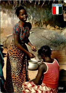 VINTAGE CONTINENTAL SIZE POSTCARD HAIR DRESSING IN THE VILLAGE IVORY COAST 1983