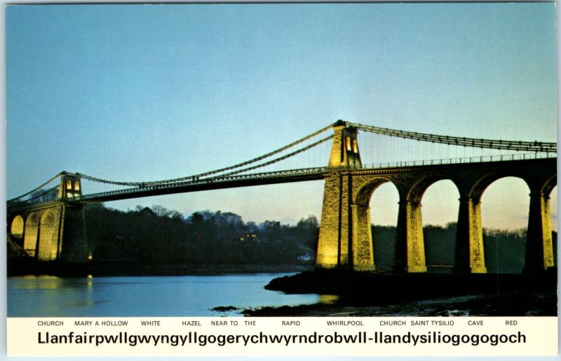 c1976 Llanfairpwllgwyngyllgogerychwyrndrobwll Menai Bridge Wales 150th Floodlit