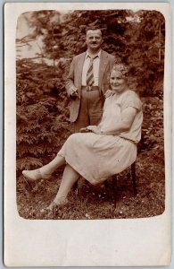 1920s RPPC Real Photo Postcard European Couple Man Smoking Woman Seated