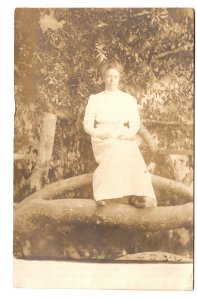 Real Photo Portrait of Woman Setting on a Tree Branch