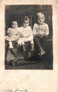 Vintage Postcard Ada's Family Photograph Three Children Sitting On Chair RPPC