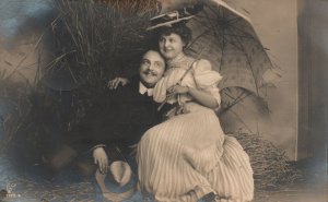 Lovers Cuddle On Hays Umbrella Beautiful Couple Romance RPPC, Vintage Postcard