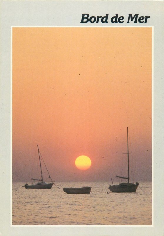 Bord de mer sunset sailing boats Postcard