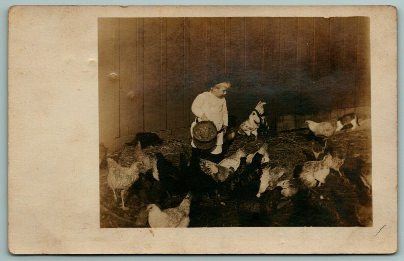 RPPC Toddler Boy Feeds Chicken in Barn From Bucket Of Field Corn~c1906 Postcard