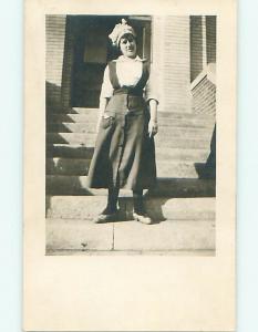 Pre-1920 rppc WOMAN IN BONNET ON STEPS OF BROWNSTONE APARTMENT r6466