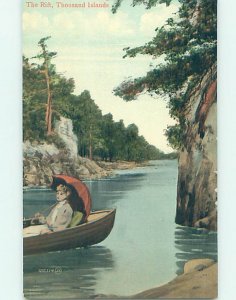 Divided-back WOMAN IN SMALL BOAT AT THE RIFT Thousand Islands New York NY AD5443