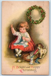 1923 Christmas Little Girl Stitching Puppy Dog Playing Cloth Berries Postcard